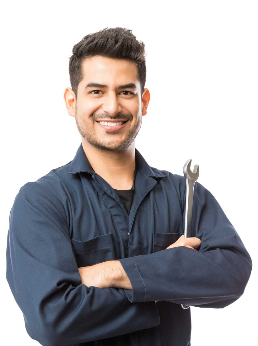 A man holding a wrench in his hands.